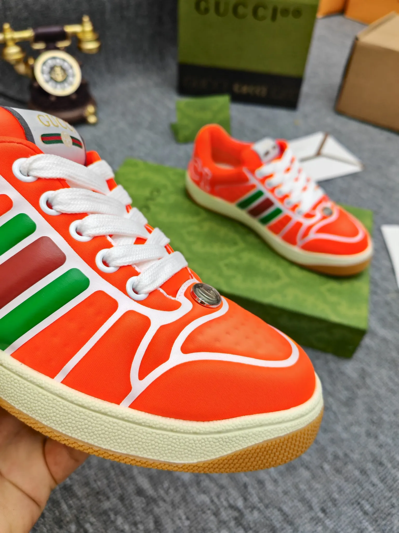 Factory price 600💰Screener series embellished web sneakers. This item is from the Gucci Lido series. Its design is inspired by the summer style and beach clubs of the Italian coast. The Screener series of sneakers draws inspiration from classic sneakers from the 1970s and takes its name from a special defensive move in sports. This shoe from the 2024 Pre-Fall collection is crafted from yellow rubber, a technical and malleable opaque material, with striped webbing on the sides and an embossed Gucci printed logo on the heel. Yellow rubber, opaque and technological in appearance. Red and green webbing decorated with metal Double G oval enamel details. Gucci printed embossed logo. Women 35-40, men 38-45, (men 38 and 45 need to be customized)